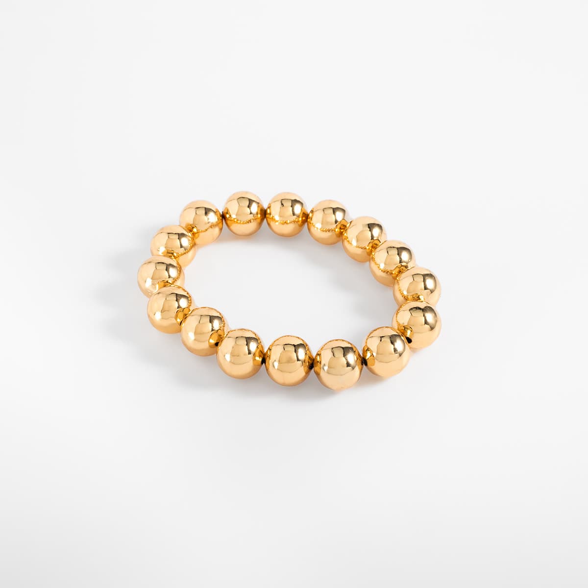 Pulsera en baño de oro esferas grandes diseño elástico